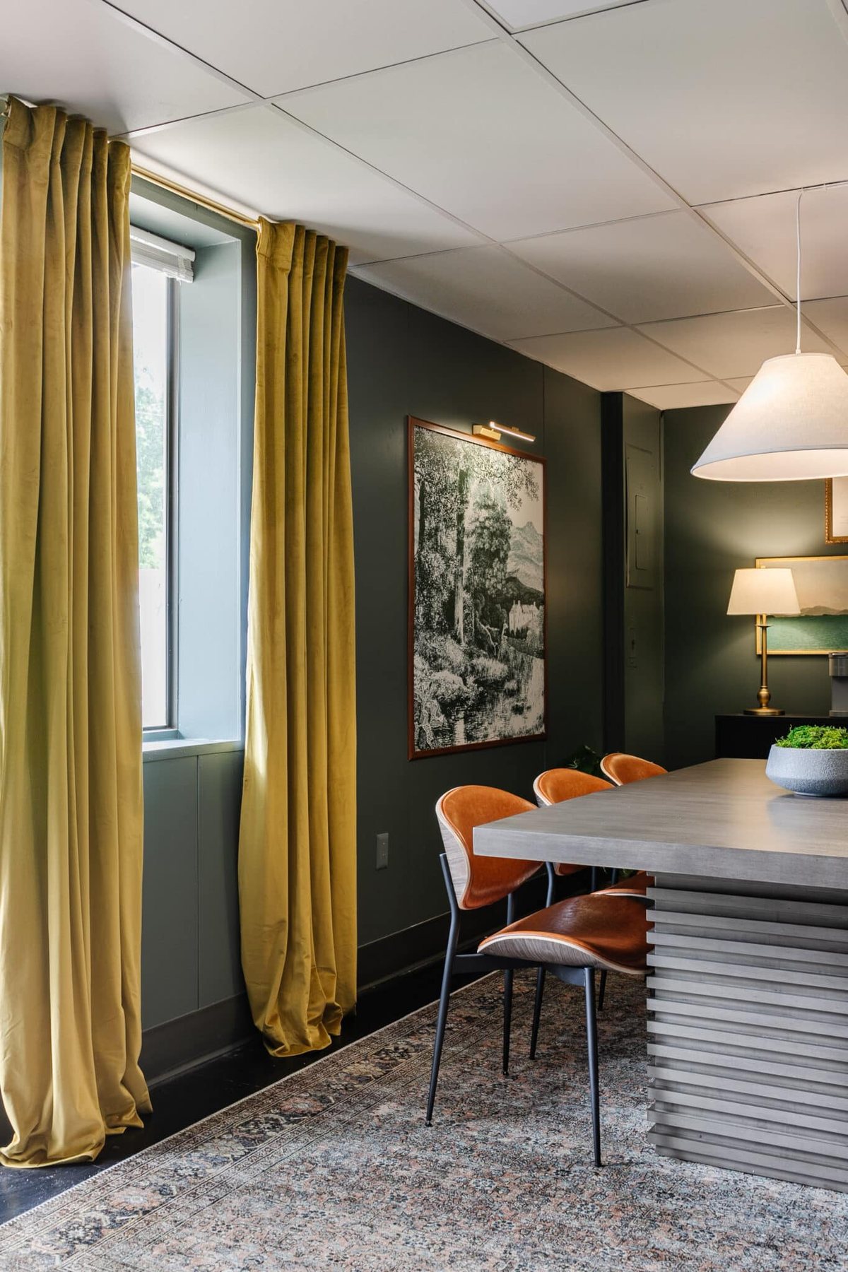 moss green curtains and teal walls in a conference room