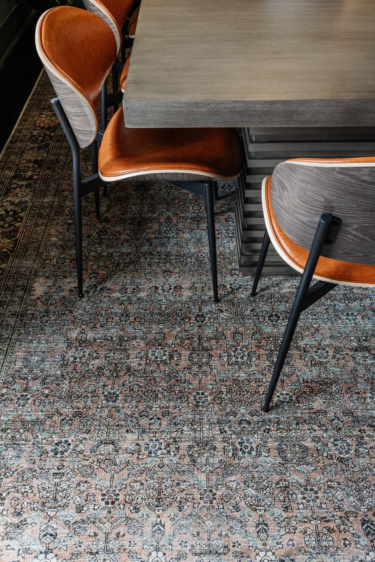 terracotta, teal, and moss green rug
