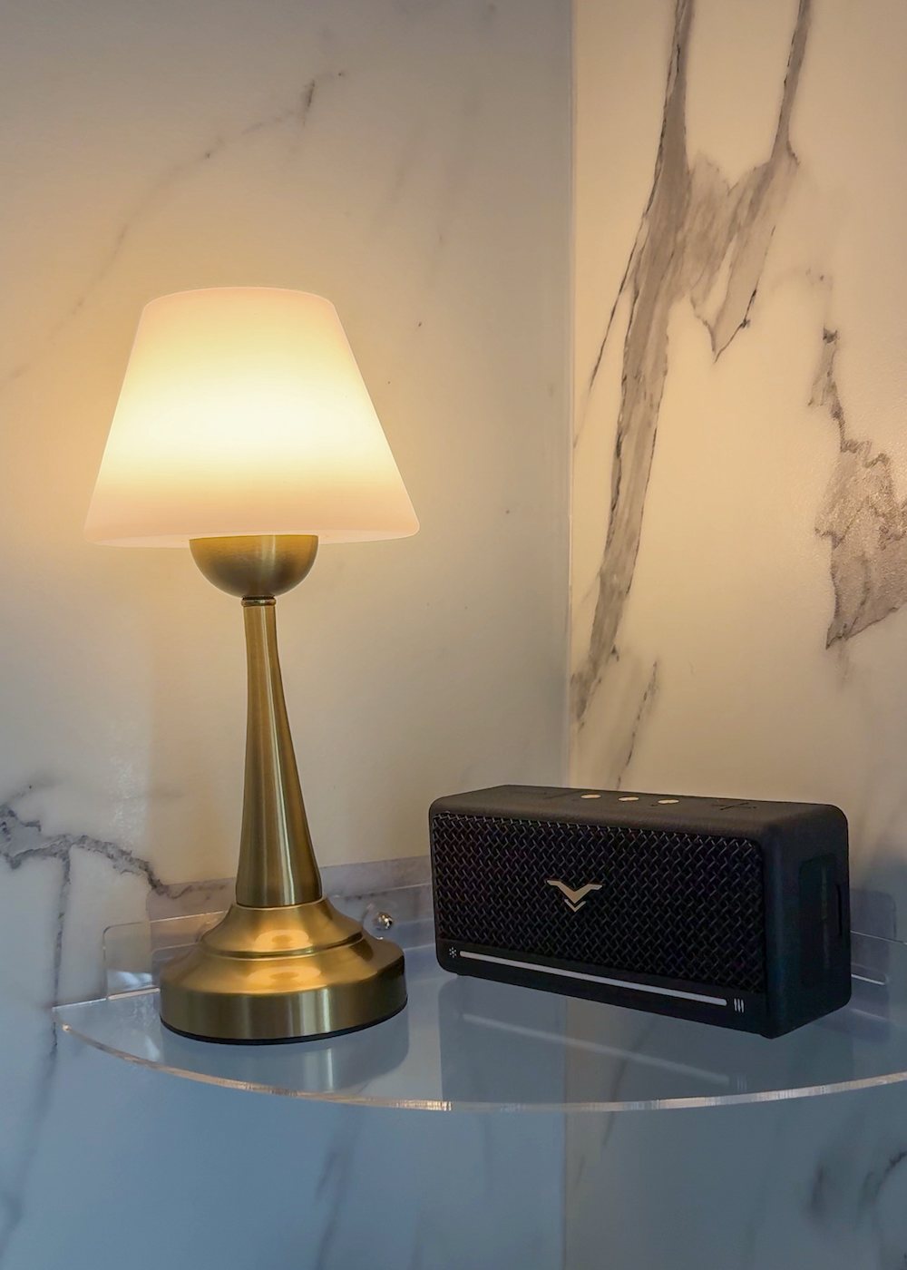 waterproof lamp on shower shelf with bluetooth speaker for a cozy bathroom
