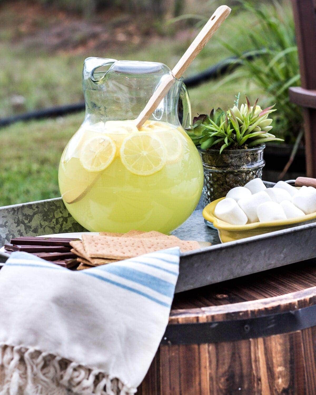 How to Decorate a Small Patio | unigumushane.com - Utilize a small patio space with chairs at each corner and a fire pit in the middle for function and entertainment. Add outdoor string lights for a cozy ambience.