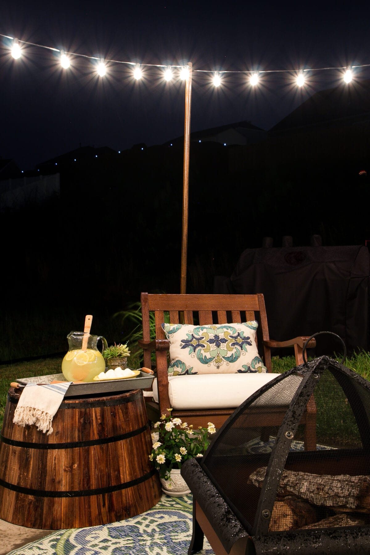 How to Decorate a Small Patio | unigumushane.com - Utilize a small patio space with chairs at each corner and a fire pit in the middle for function and entertainment. Add outdoor string lights for a cozy ambience.