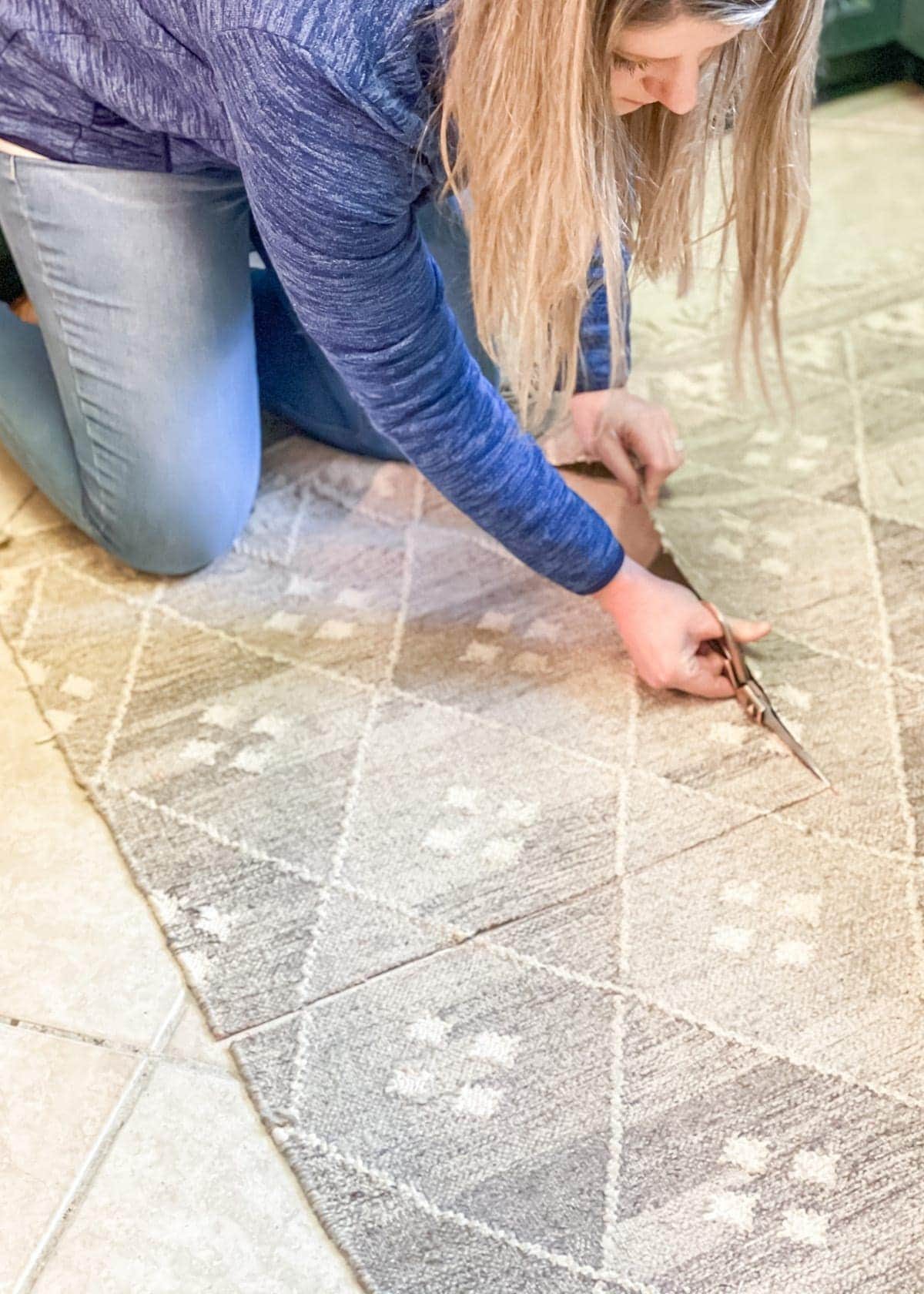 cutting up an old rug to make tapestry art