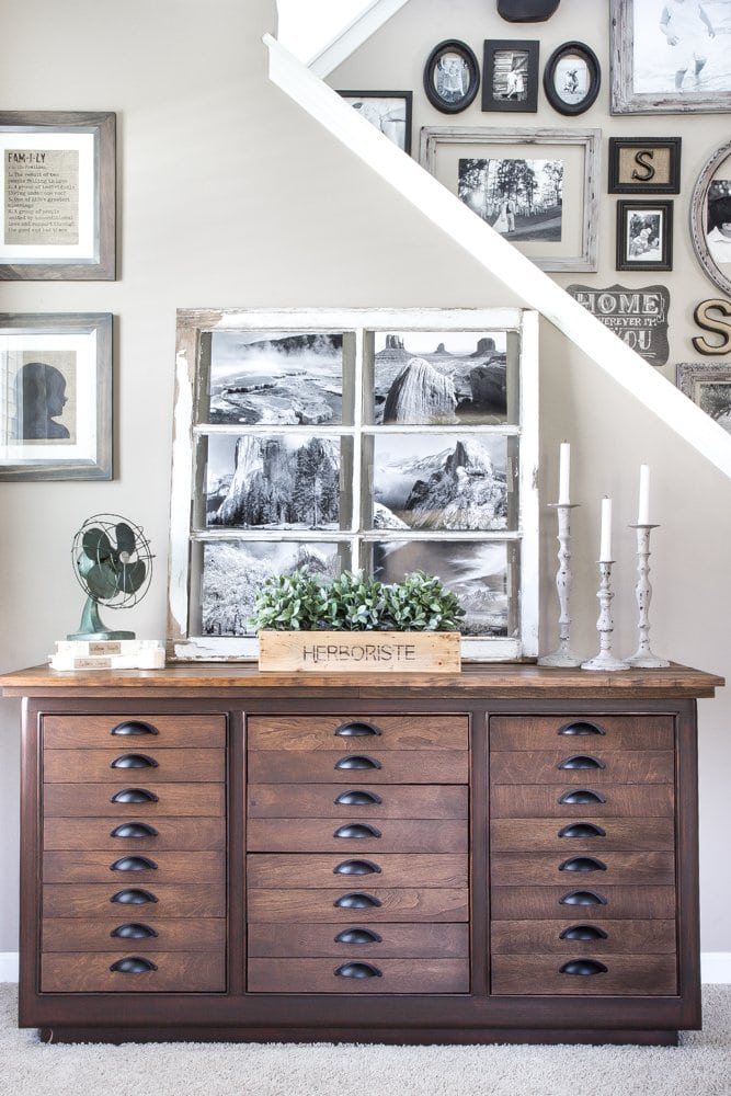 cut up old calendars in an old window as diy large wall art
