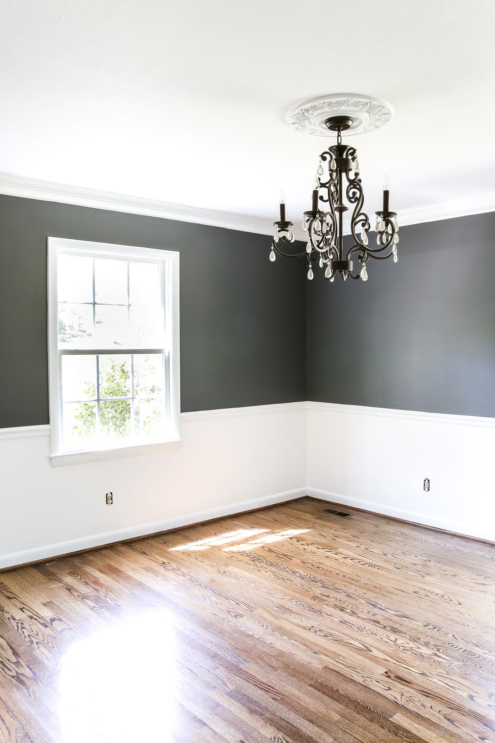 Dining Room Beginnings | unigumushane.com - A dining room gets a quick paint makeover with Benjamin Moore semi-gloss Simply White and eggshell Kendall Charcoal for a high contrast look.