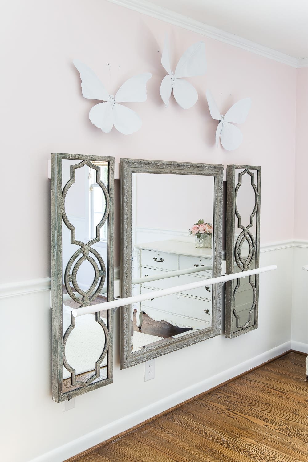 How to make a ballet barre with mirrors and shelf brackets and how to hang wall decor on a chair rail, board and batten, or molding #balletbarre #kidsdecor #girldecor #girlbedroom #girlroom #kidsroom #walldecor #hanginghack #wallhack #diywalldecor