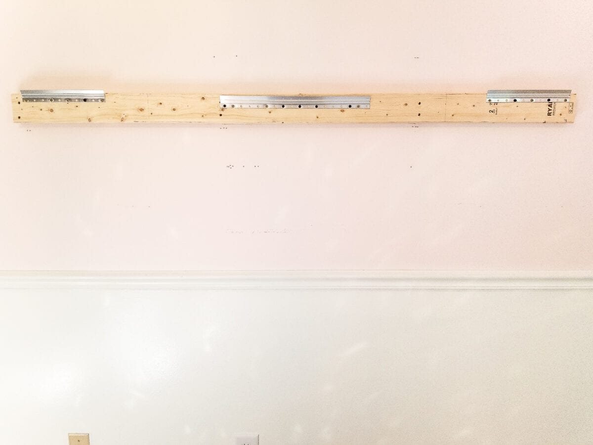 How to make a ballet barre with mirrors and shelf brackets and how to hang wall decor on a chair rail, board and batten, or molding #balletbarre #kidsdecor #girldecor #girlbedroom #girlroom #kidsroom #walldecor #hanginghack #wallhack #diywalldecor
