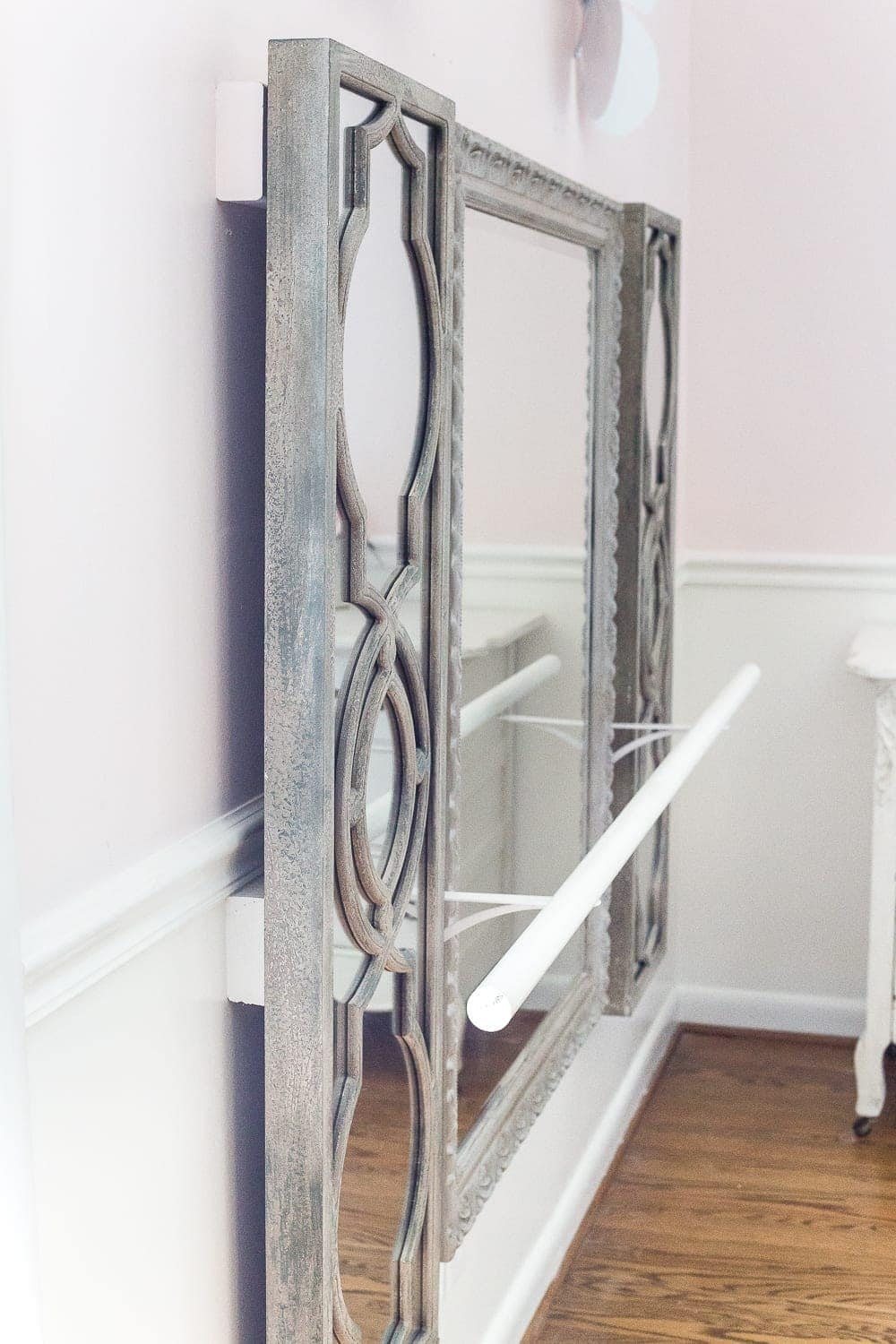 How to make a ballet barre with mirrors and shelf brackets and how to hang wall decor on a chair rail, board and batten, or molding #balletbarre #kidsdecor #girldecor #girlbedroom #girlroom #kidsroom #walldecor #hanginghack #wallhack #diywalldecor