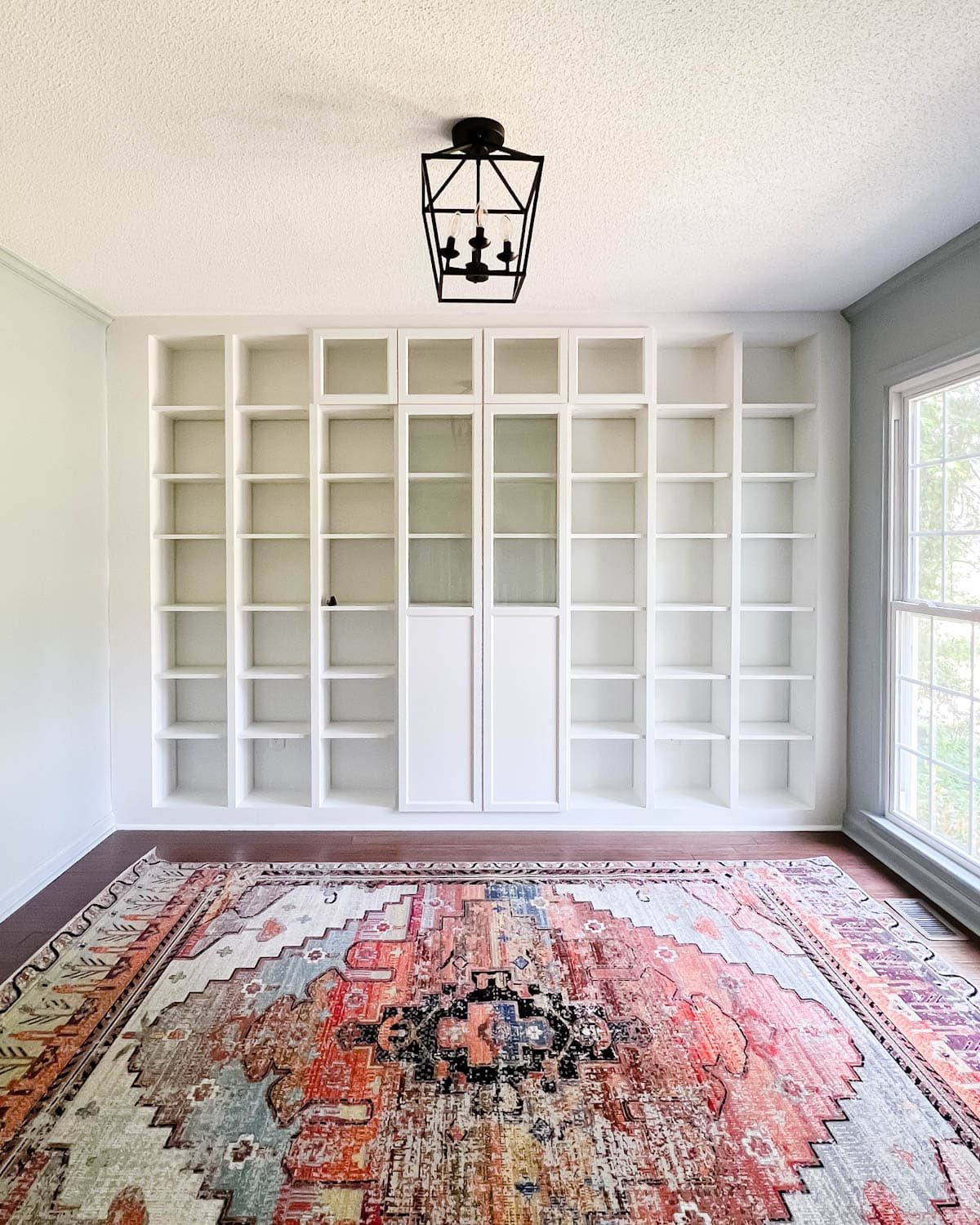 Oxberg doors added to bookcases for concealed storage