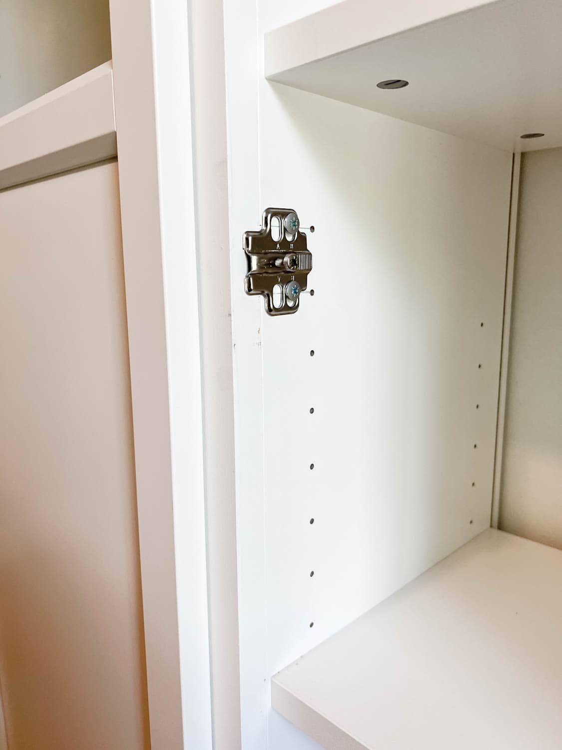 door hardware added to bookcases to hang Oxberg doors