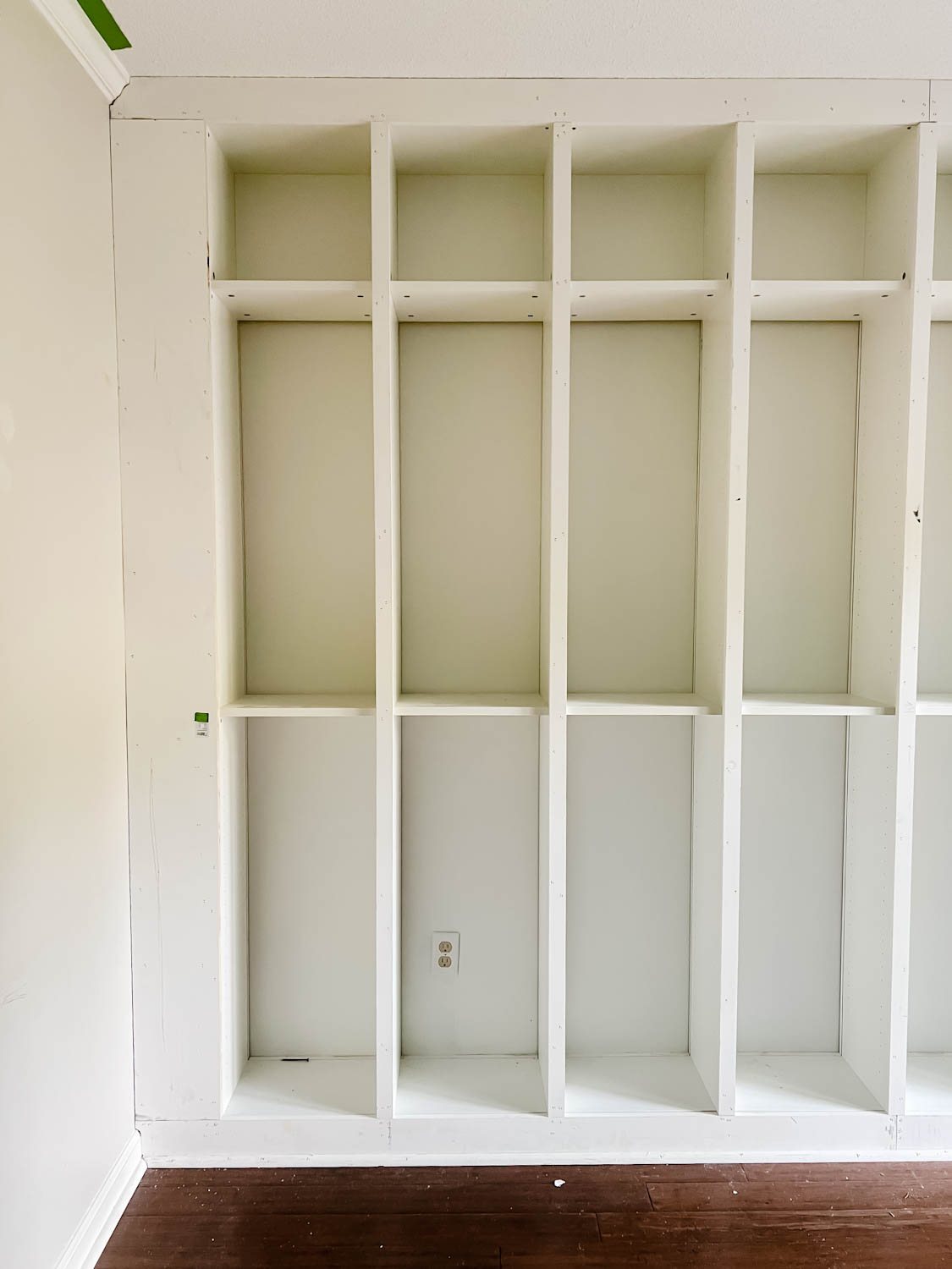 boards added to IKEA billy bookcases to make them look like built in bookshelves