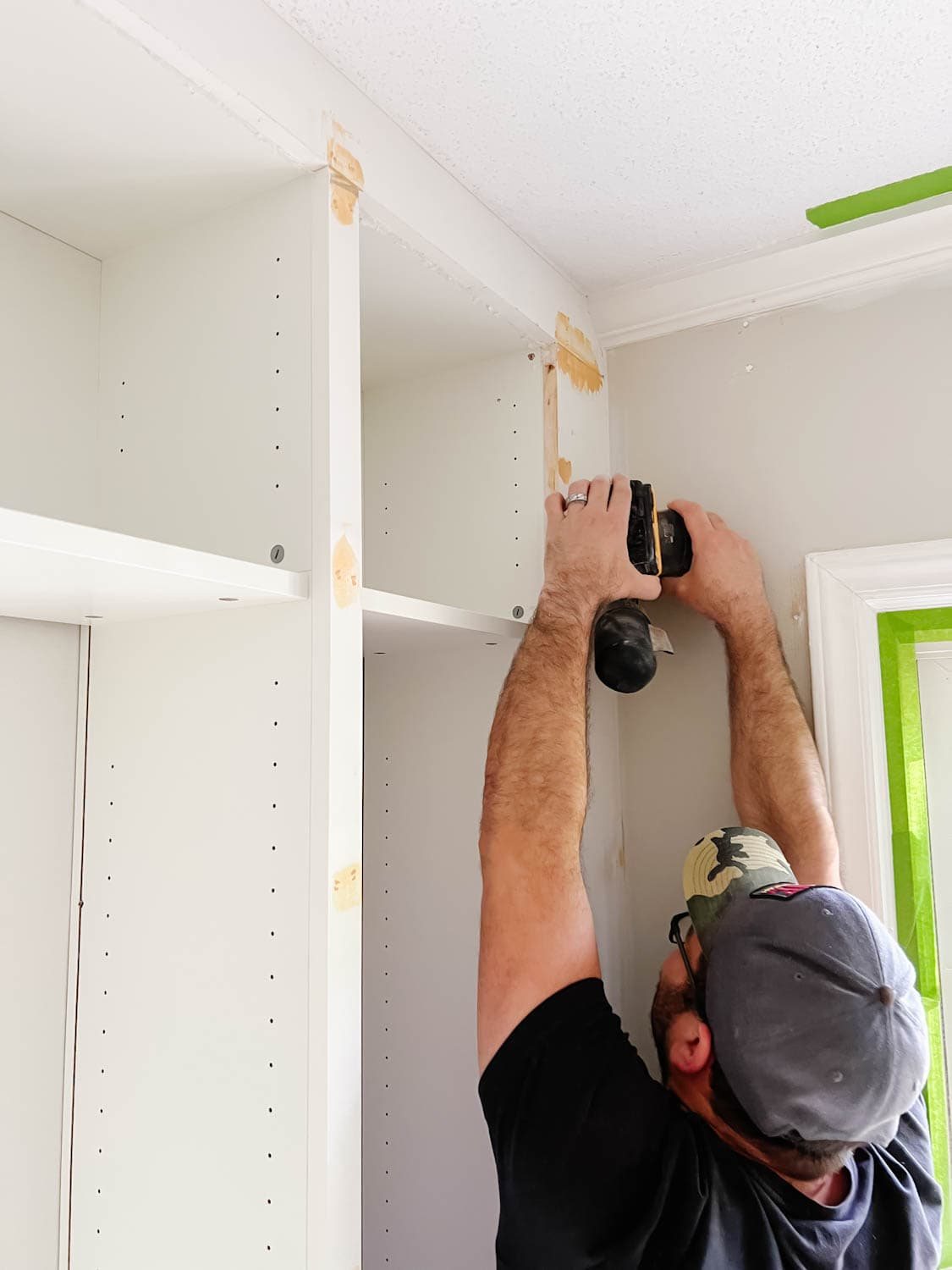 orbital sander used to smooth out wood filler and Loctite foam