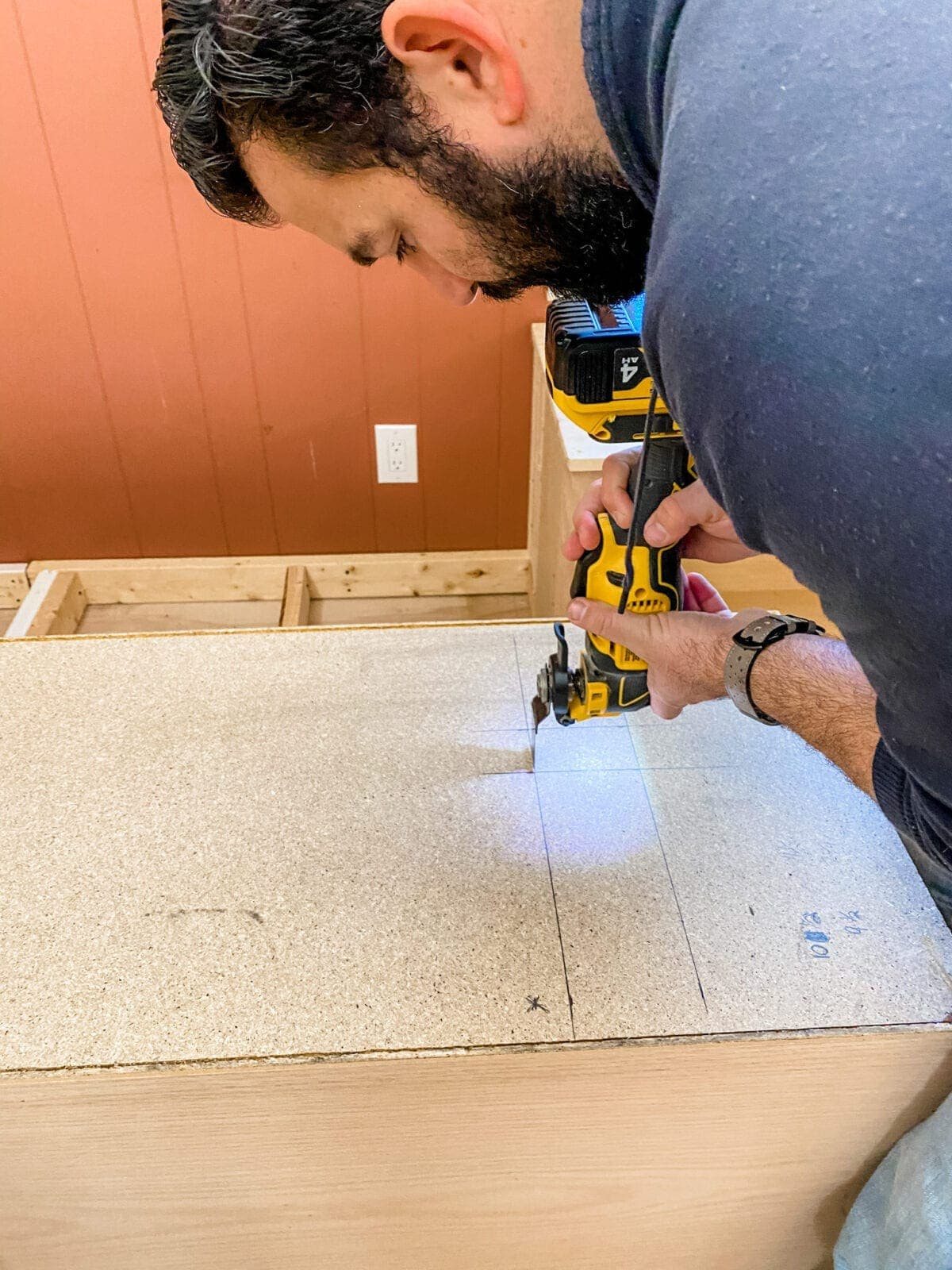 A step-by-step tutorial to build DIY built in cabinets and a window seat using inexpensive stock kitchen cabinets.