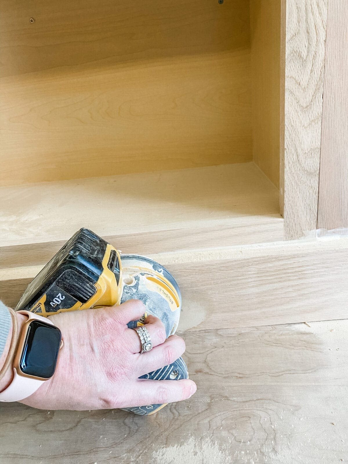 A step-by-step tutorial to build DIY built in cabinets and a window seat using inexpensive stock kitchen cabinets.