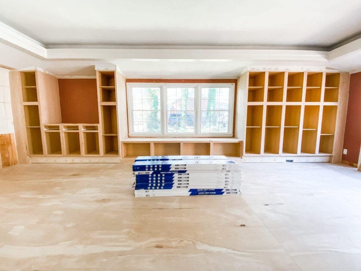 A step-by-step tutorial to build DIY built in cabinets and a window seat using inexpensive stock kitchen cabinets.