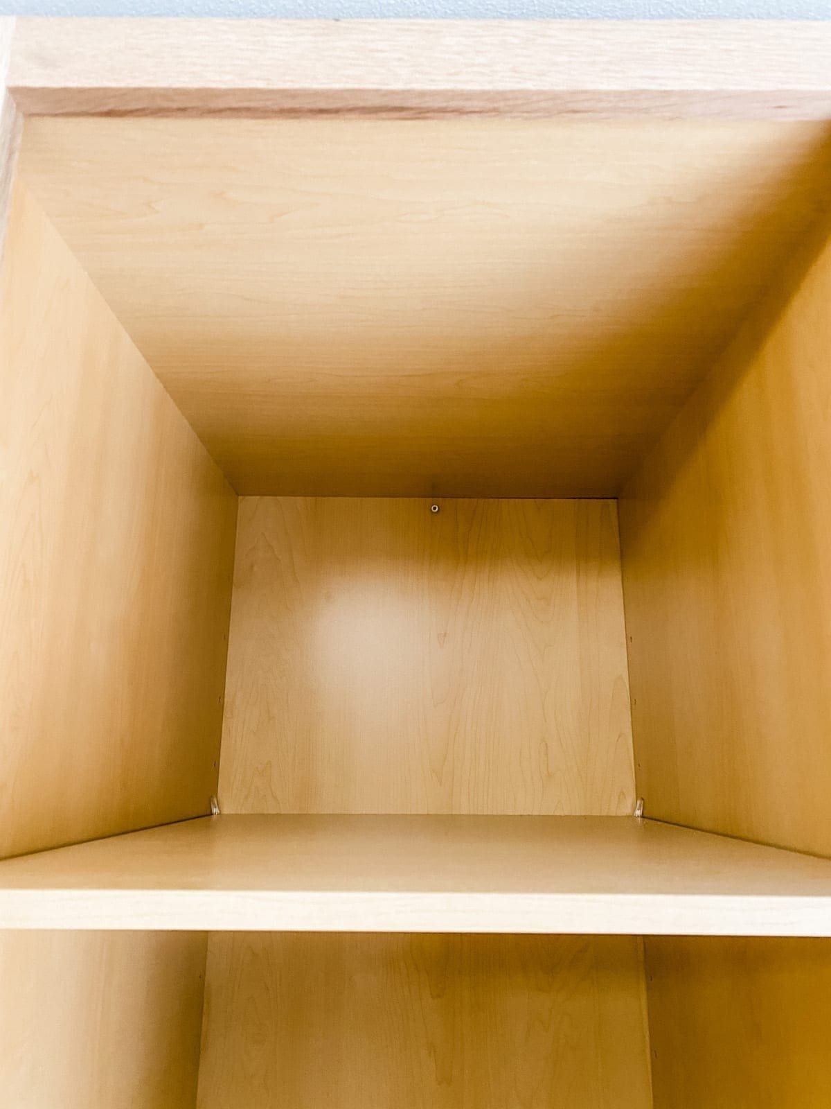 A step-by-step tutorial to build DIY built in cabinets and a window seat using inexpensive stock kitchen cabinets.