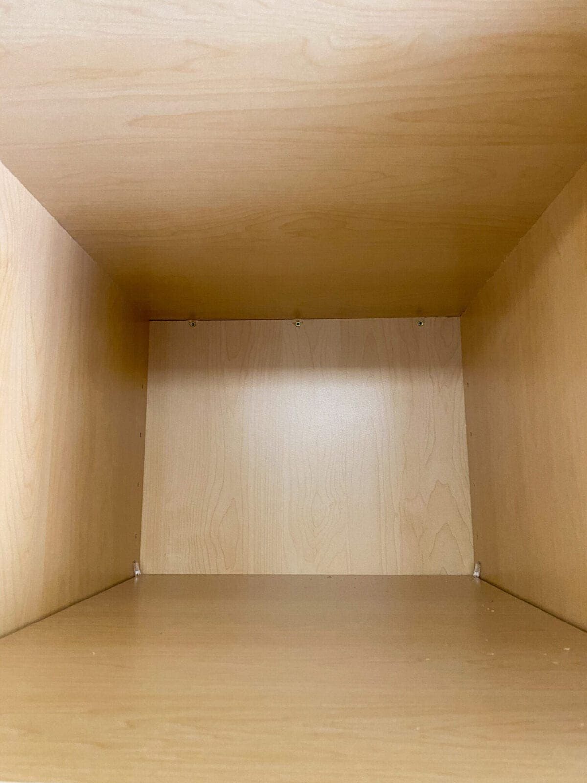 A step-by-step tutorial to build DIY built in cabinets and a window seat using inexpensive stock kitchen cabinets.