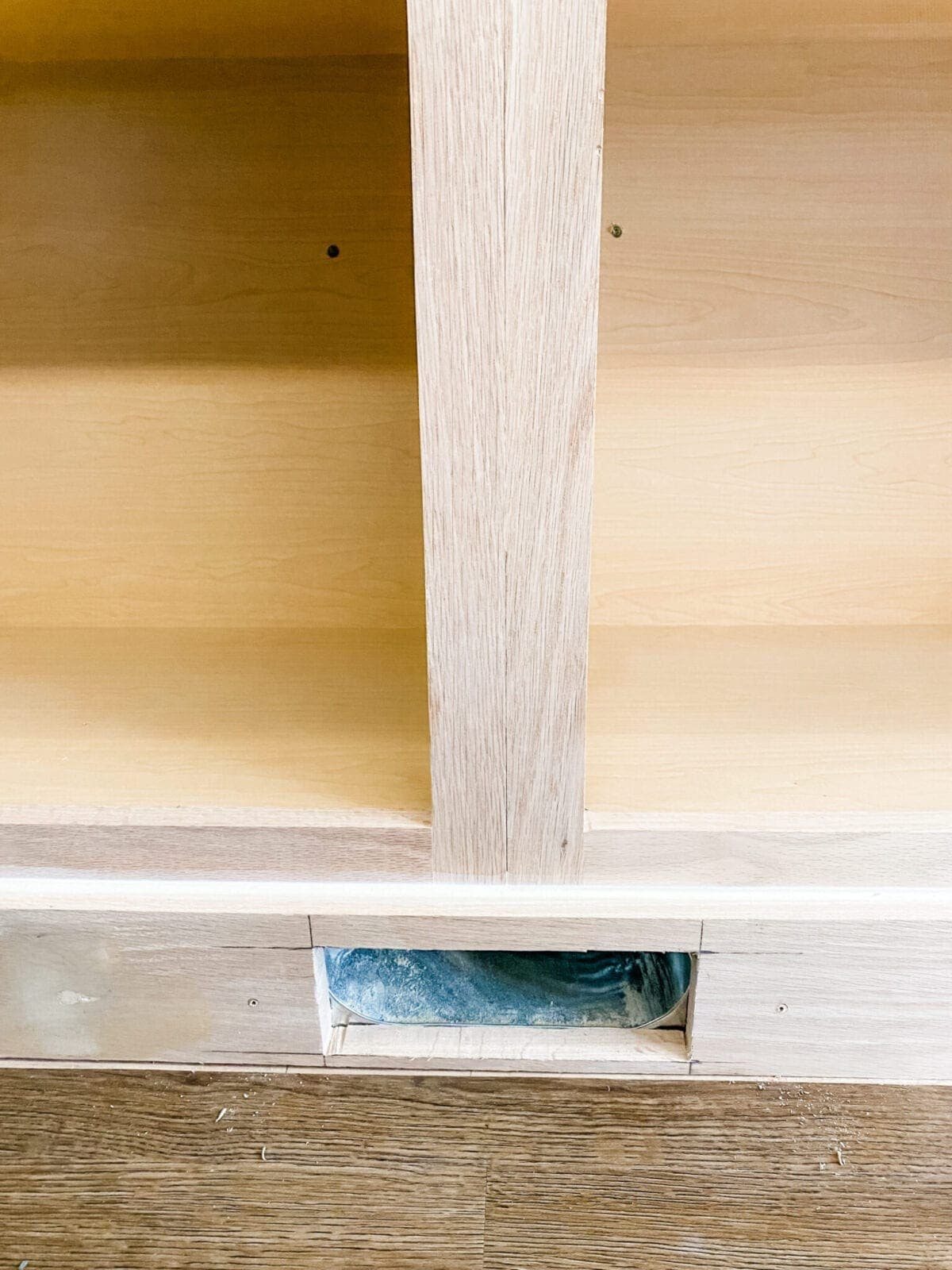 A step-by-step tutorial to build DIY built in cabinets and a window seat using inexpensive stock kitchen cabinets.