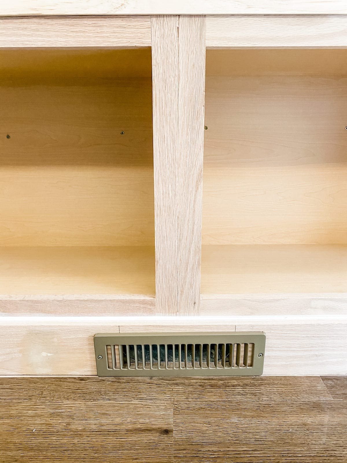A step-by-step tutorial to build DIY built in cabinets and a window seat using inexpensive stock kitchen cabinets.