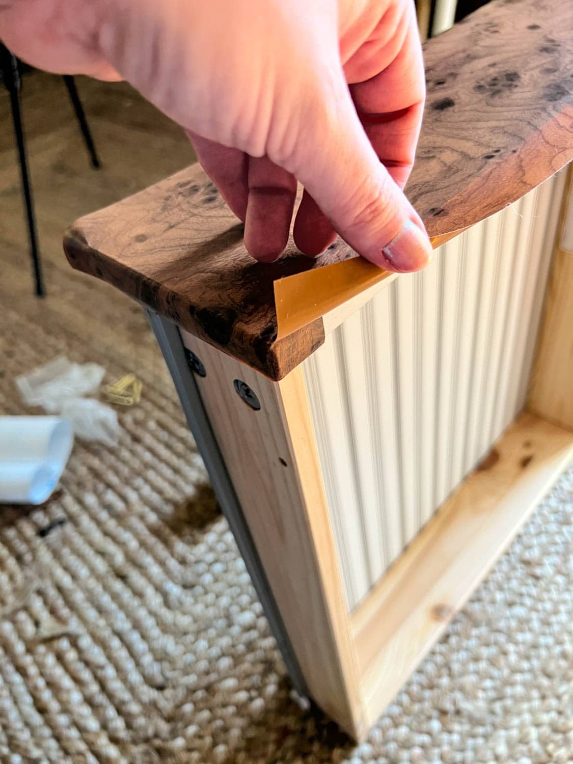 wrapping a dresser drawer with burl wood contact paper