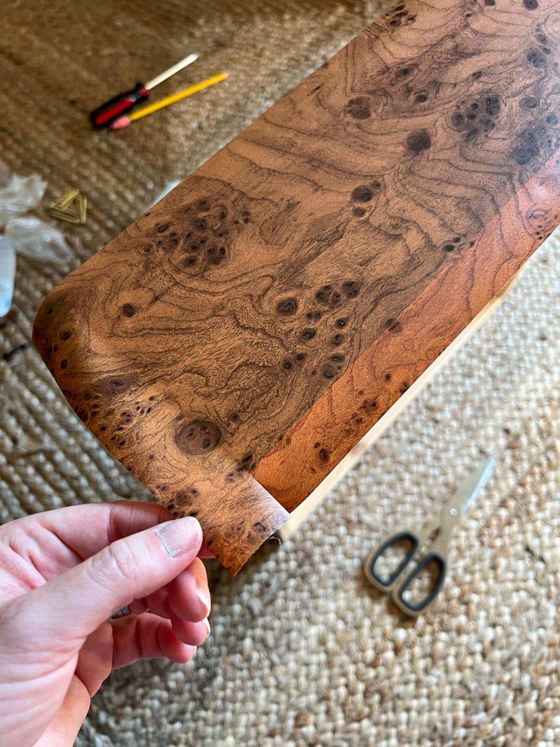 cutting excess contact paper for furniture wrapping