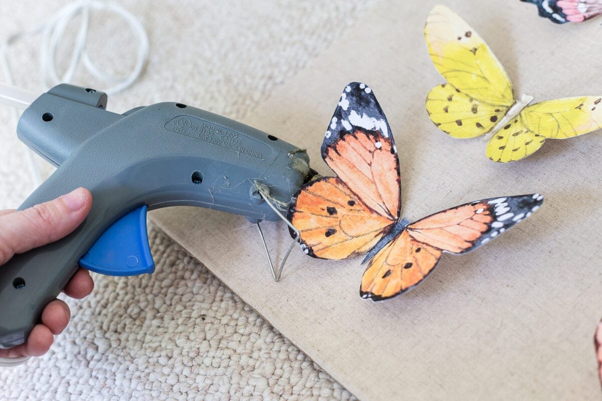 A tutorial about how to make an inexpensive modern Victorian style butterfly study shadow box with free printables of watercolor butterfly graphics for a little girl bedroom. #kidsdecor #girlbedroom #girlroom #kidsbedroom #wallart #kidsart #kidswallart #butterfly #butterflies #butterflydecor #girlydecor #nursery
