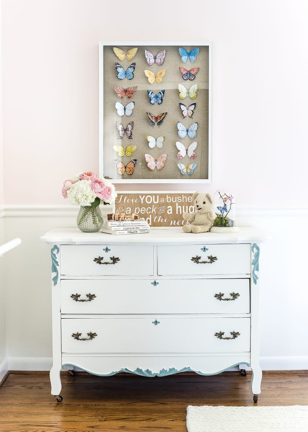 A tutorial about how to make an inexpensive modern Victorian style butterfly study shadow box with free printables of watercolor butterfly graphics for a little girl bedroom. #kidsdecor #girlbedroom #girlroom #kidsbedroom #wallart #kidsart #kidswallart #butterfly #butterflies #butterflydecor #girlydecor #nursery