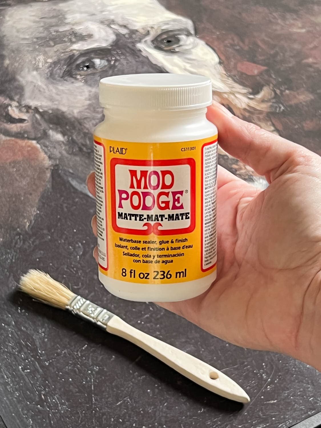 Matte Mod Podge brushing on art print