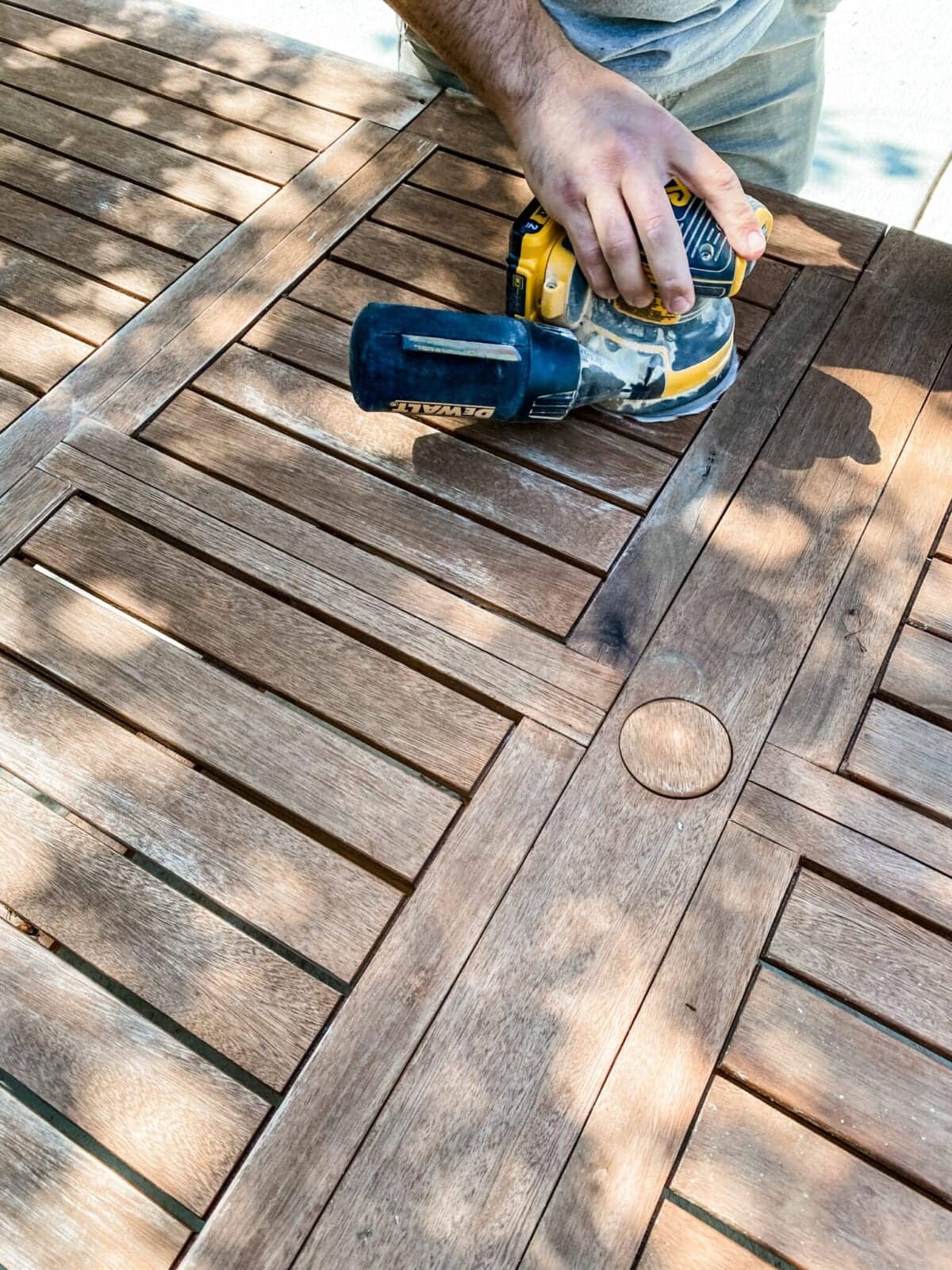 sanding an outdoor table