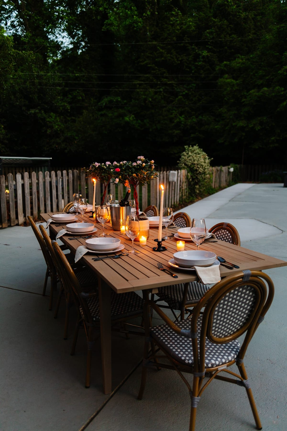 night time backyard patio and back porch with string lights and candlelight
