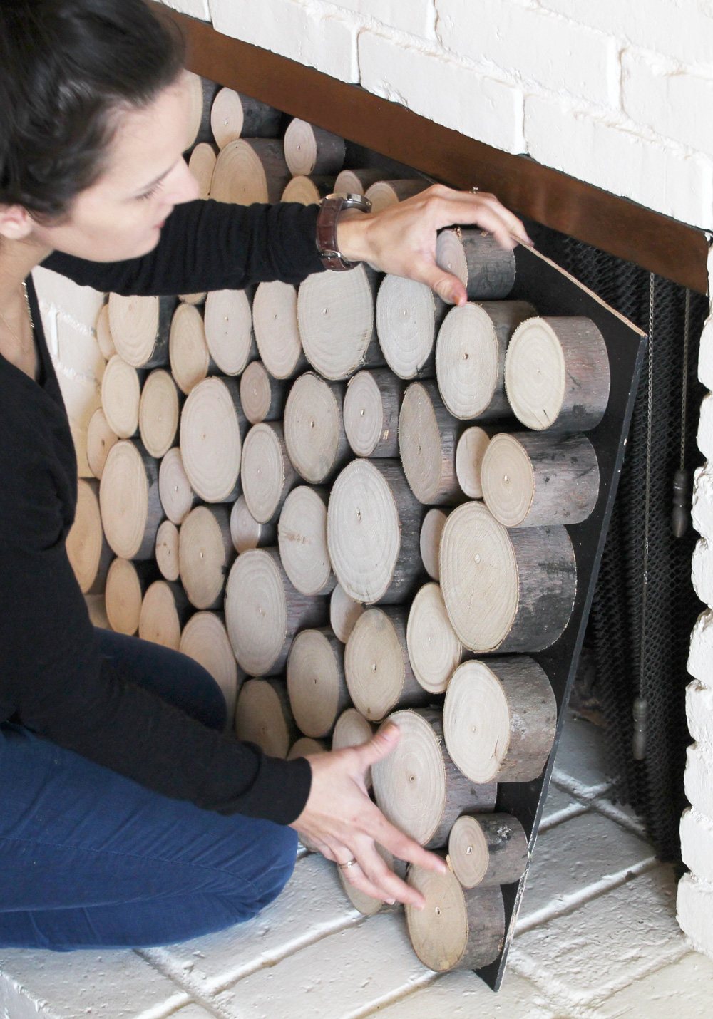 faux log stack door for a fireplace