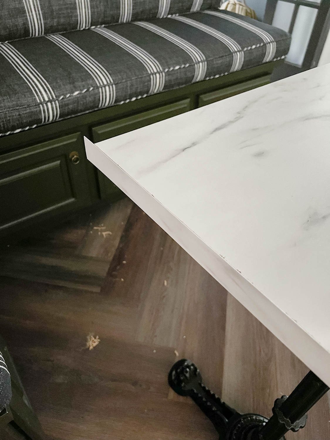 attaching laminate strip to a cut faux marble dining table top