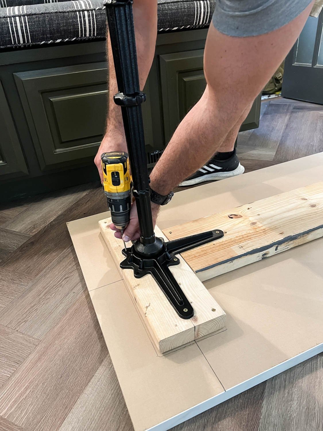 screwing cast iron pedestal table legs into a table top