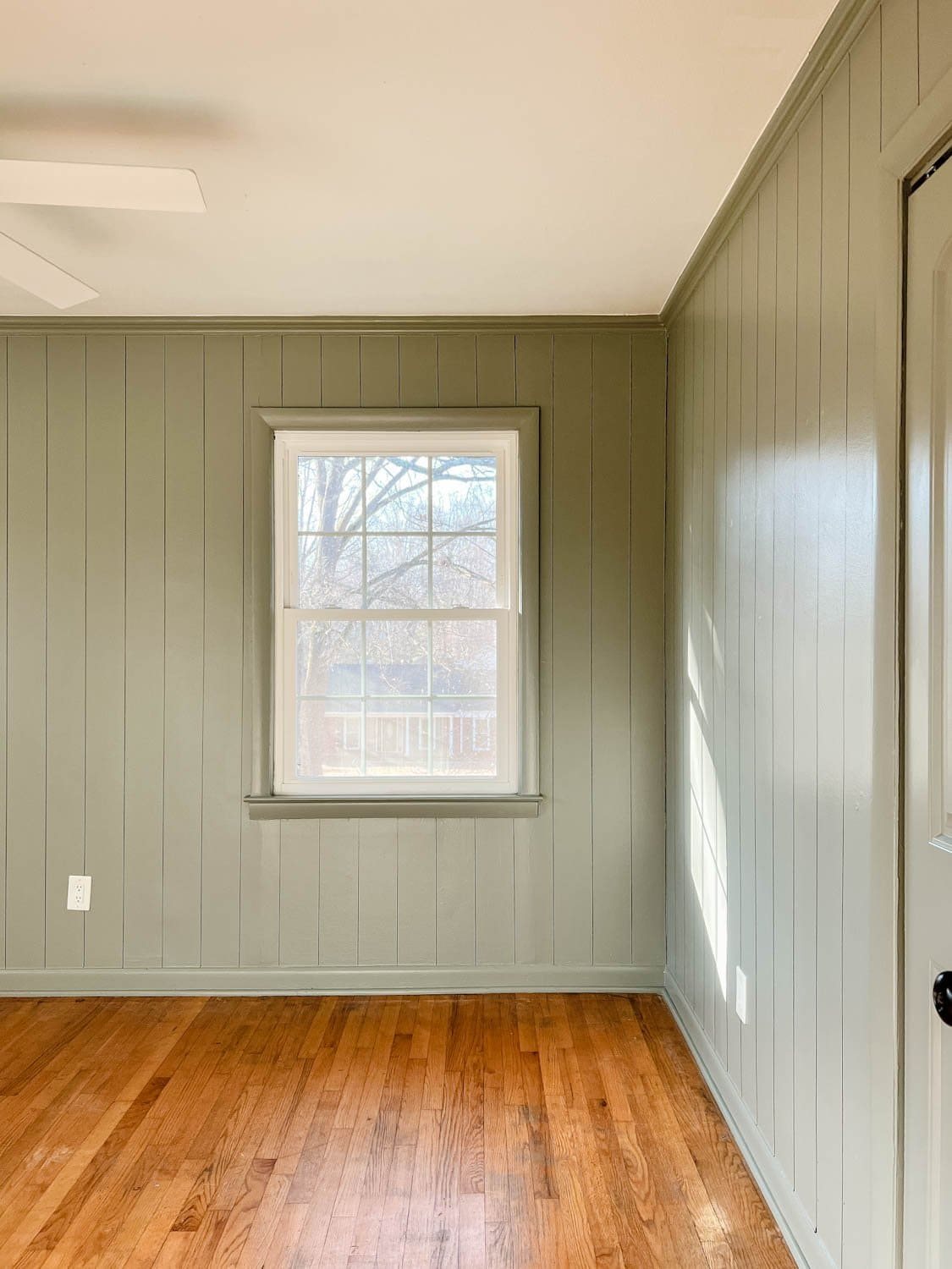 Bedroom painted Sherwin Williams Evergreen Fog with faux planked walls
