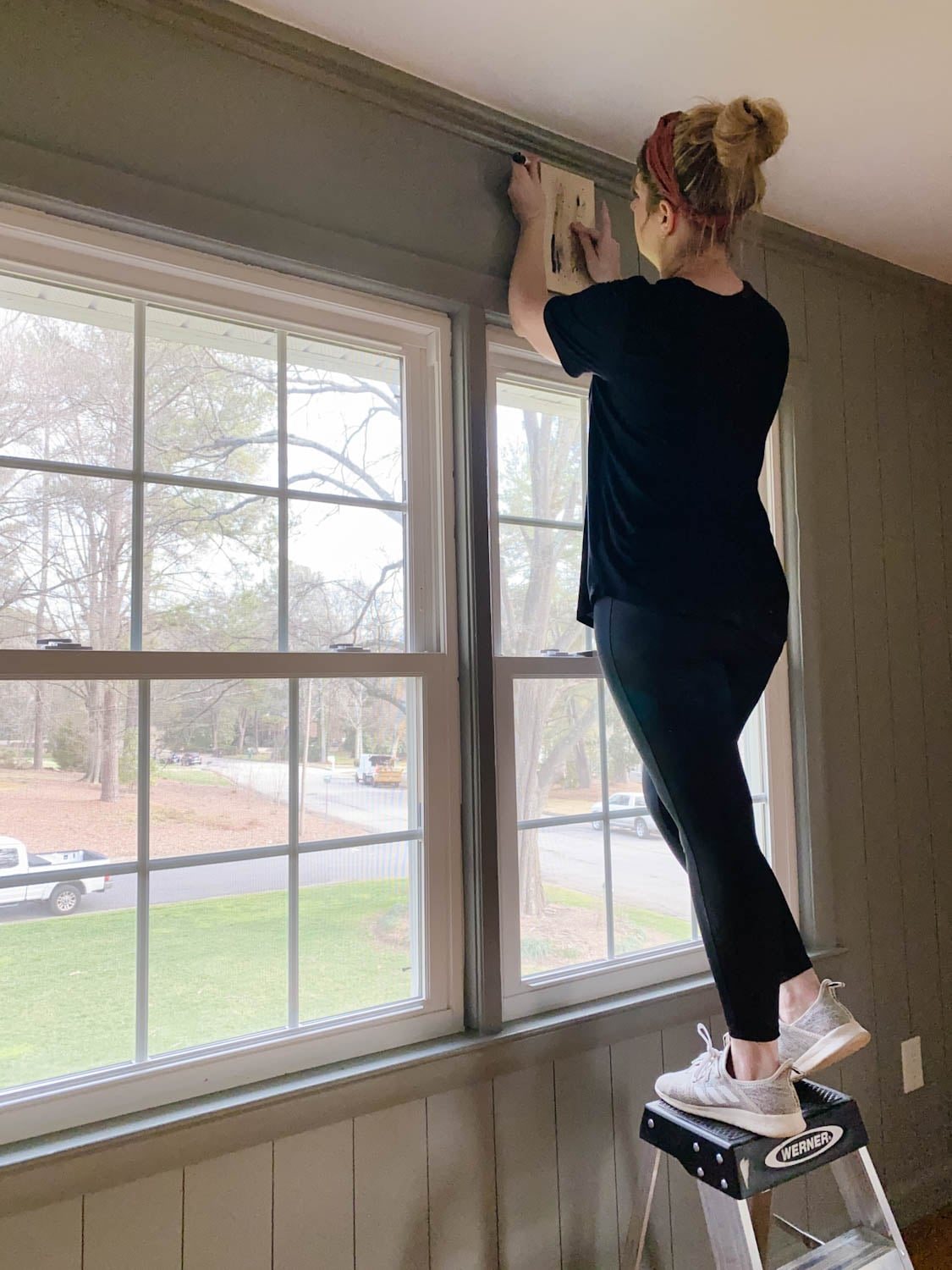 Tracing 1x6 boards with Sharpie paint pens for faux paneled walls over a window