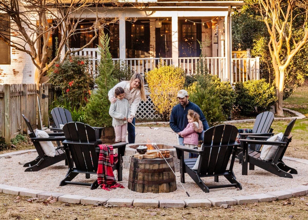 diy fire pit with pea gravel and adirondack chairs