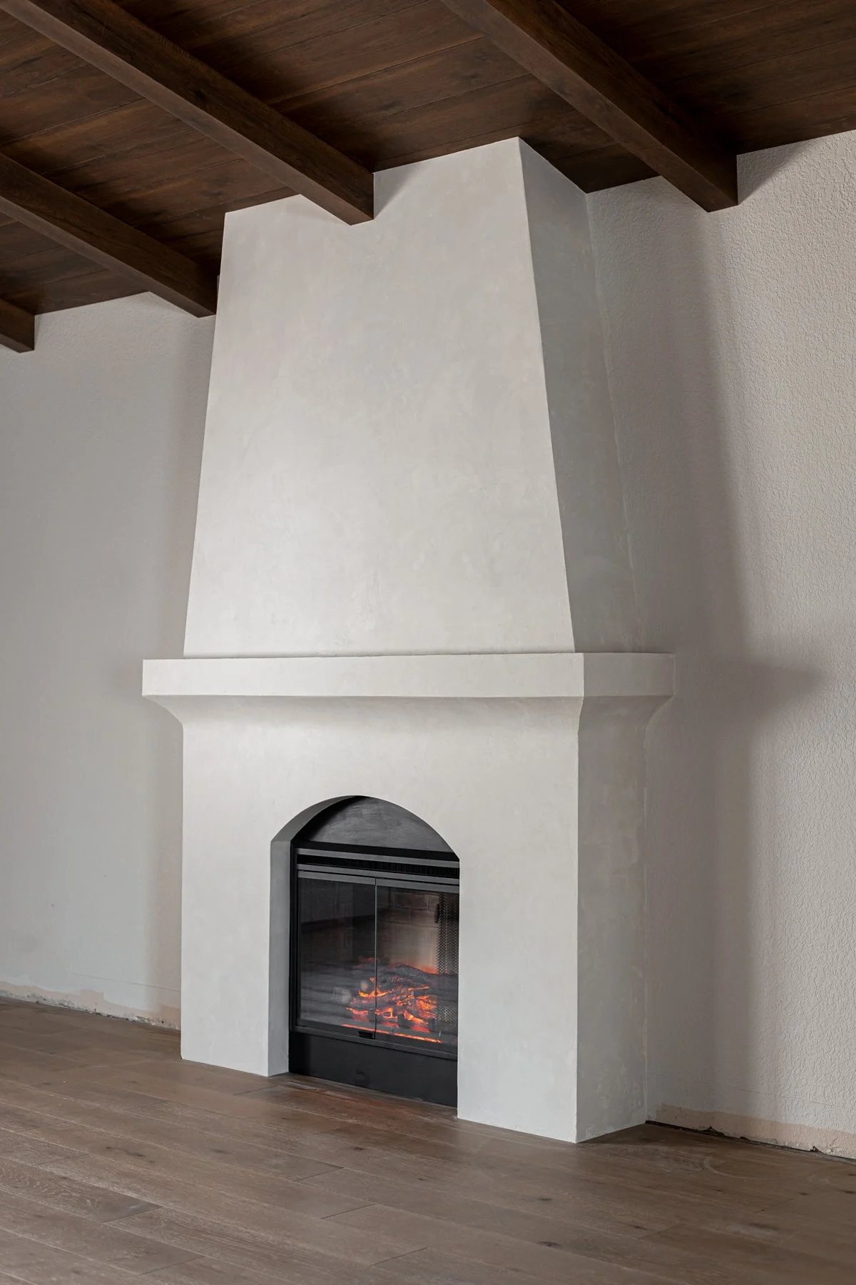 diy built-in electric fireplace with venetian plaster