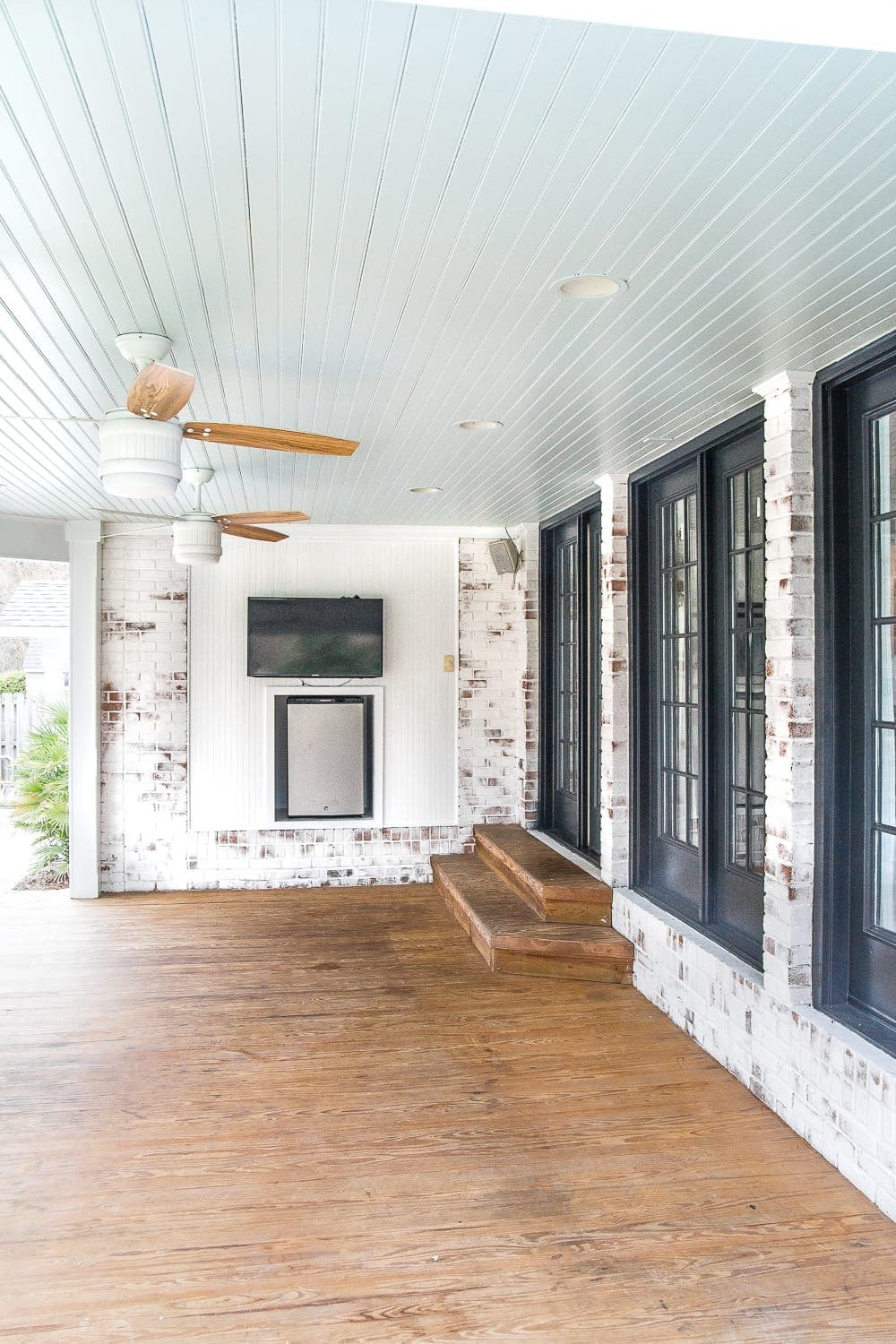 back porch with haint blue porch ceiling and black French doors
