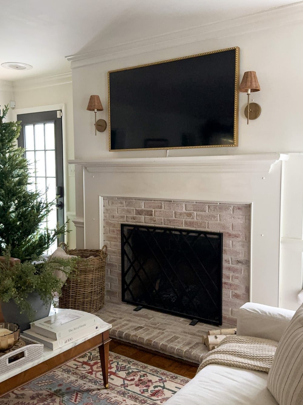 plain mantel with limewashed brick fireplace