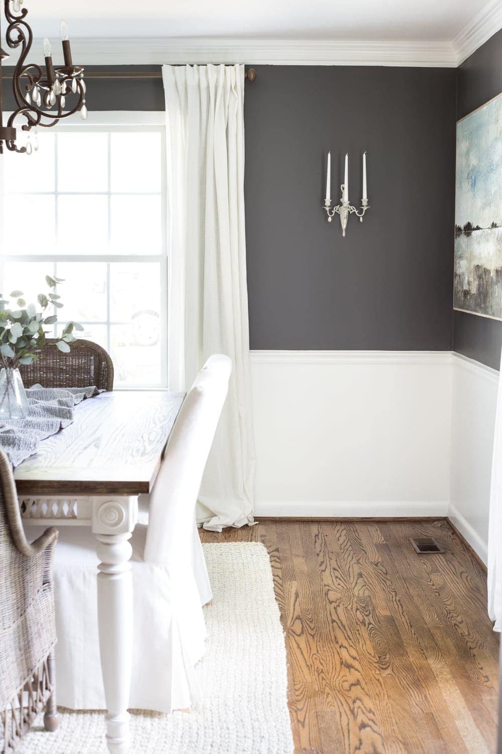 Benjamin Moore Kendall Charcoal dining room with French sconce