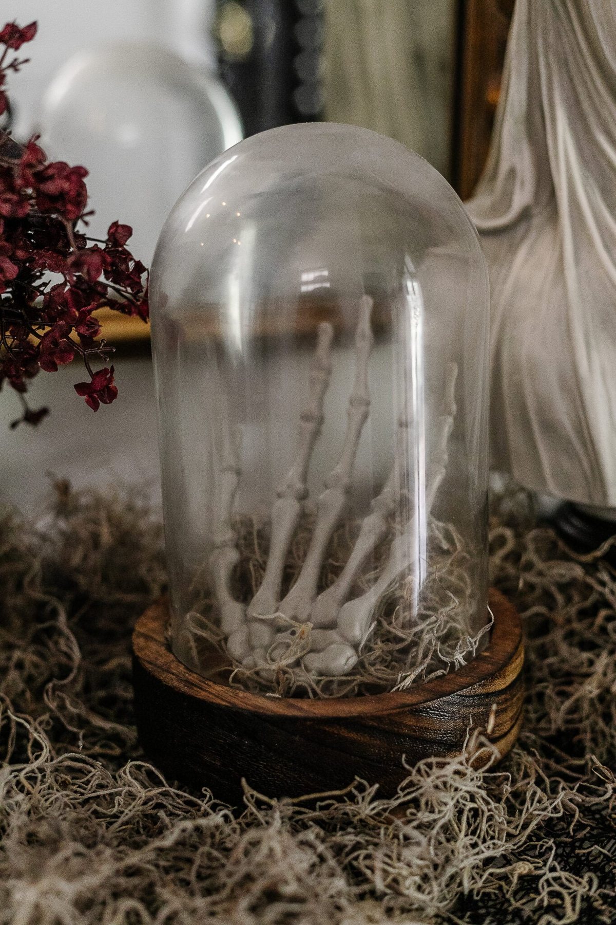 DIY Halloween decor skeleton hand in a cloche