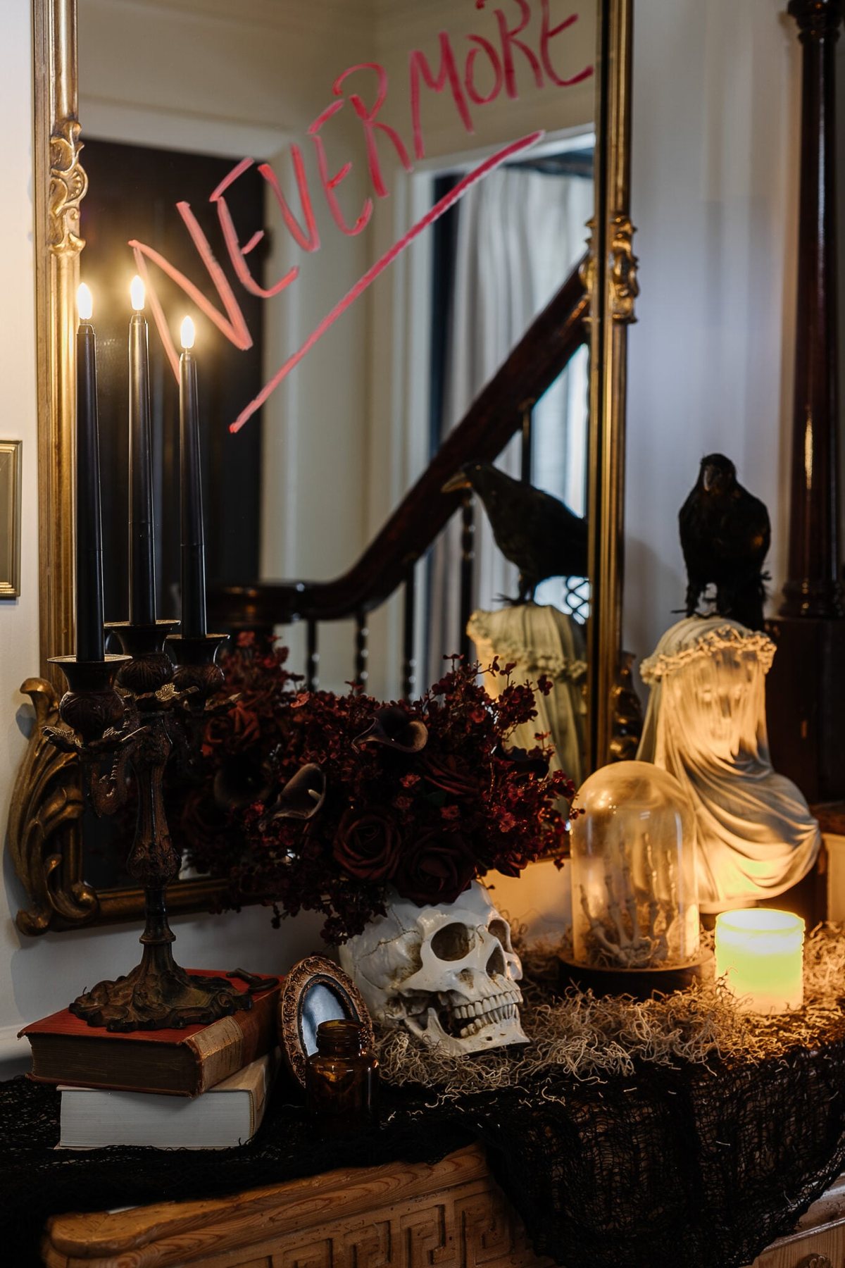 haunted house halloween decor on entryway table