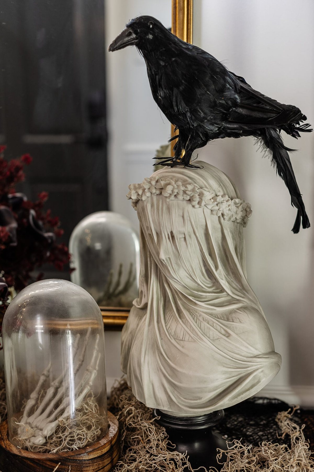 veiled statue bust with fake crow on top for DIY haunted house