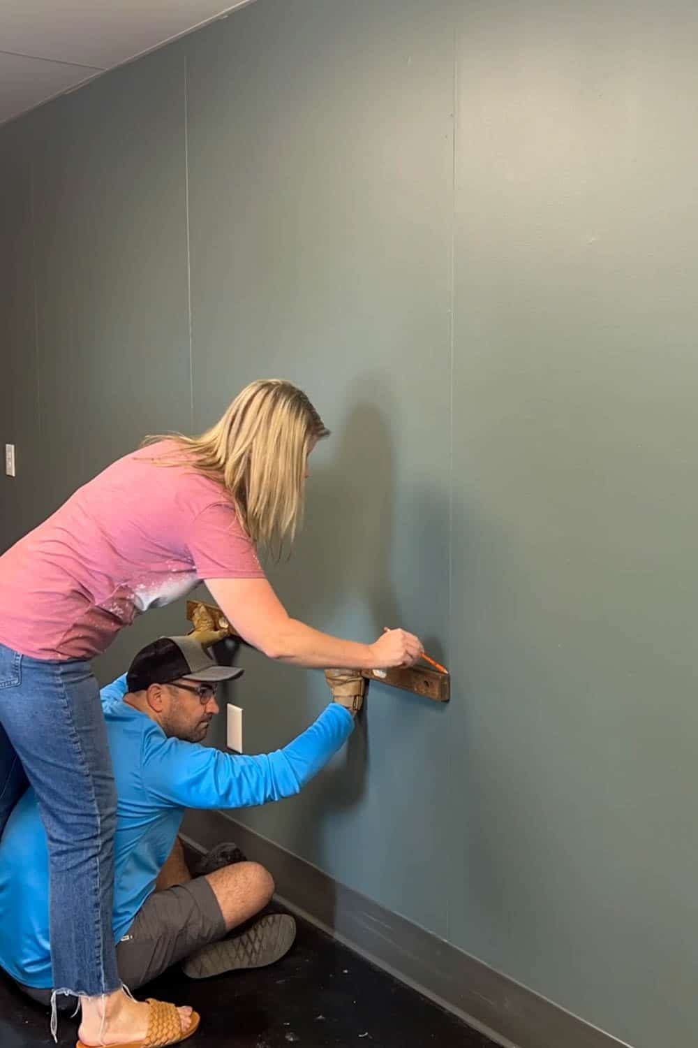 marking the wall with a level and pencil