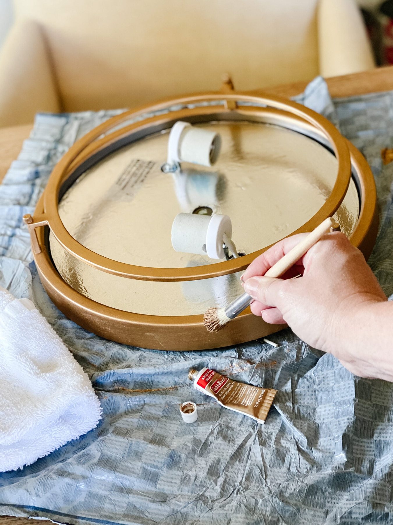 painting rub n buff on a light fixture