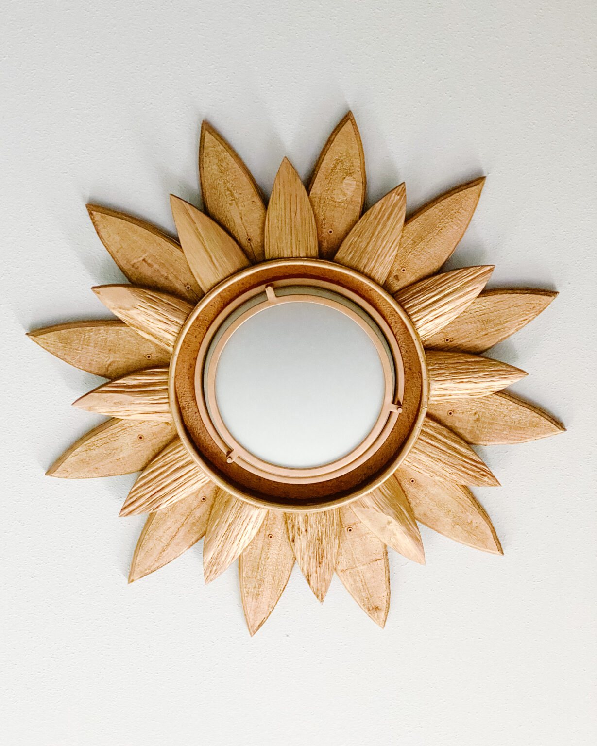diy light fixture made from a repurposed sunburst mirror