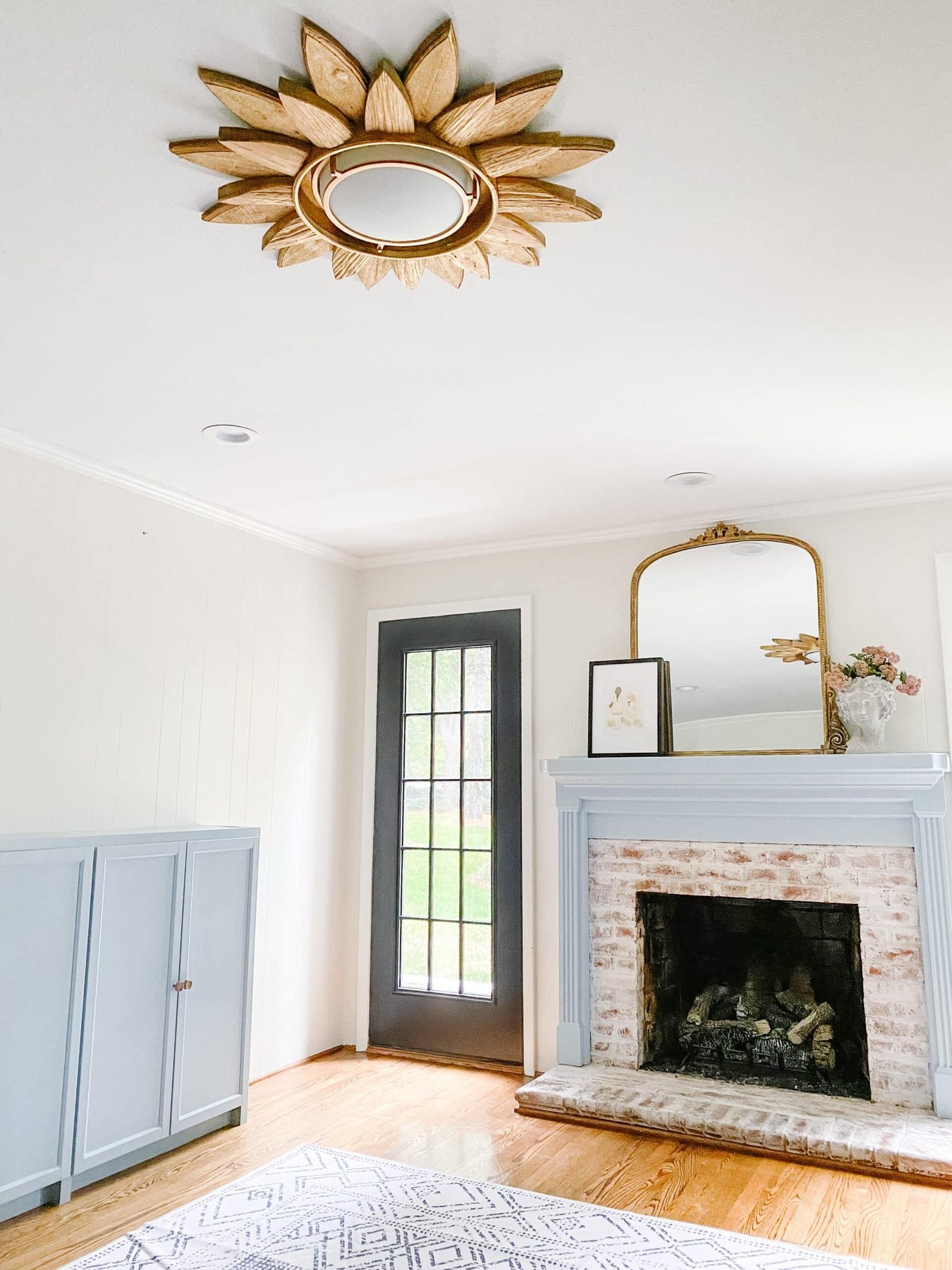 sunburst mirror diy light fixture in a playroom