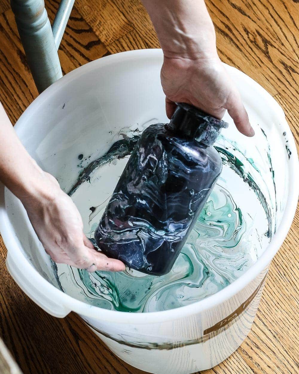 DIY Marbled Vases and Halloween Entryway | unigumushane.com - A quick tutorial for how to turn old jars and bottles into marbled vases (using nail polish) on the cheap that are modern works of art.