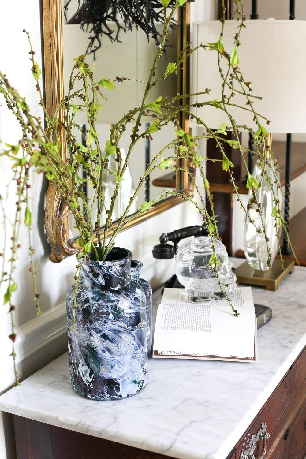 DIY Marbled Vases and Halloween Entryway | unigumushane.com - A quick tutorial for how to turn old jars and bottles into marbled vases (using nail polish) on the cheap that are modern works of art.