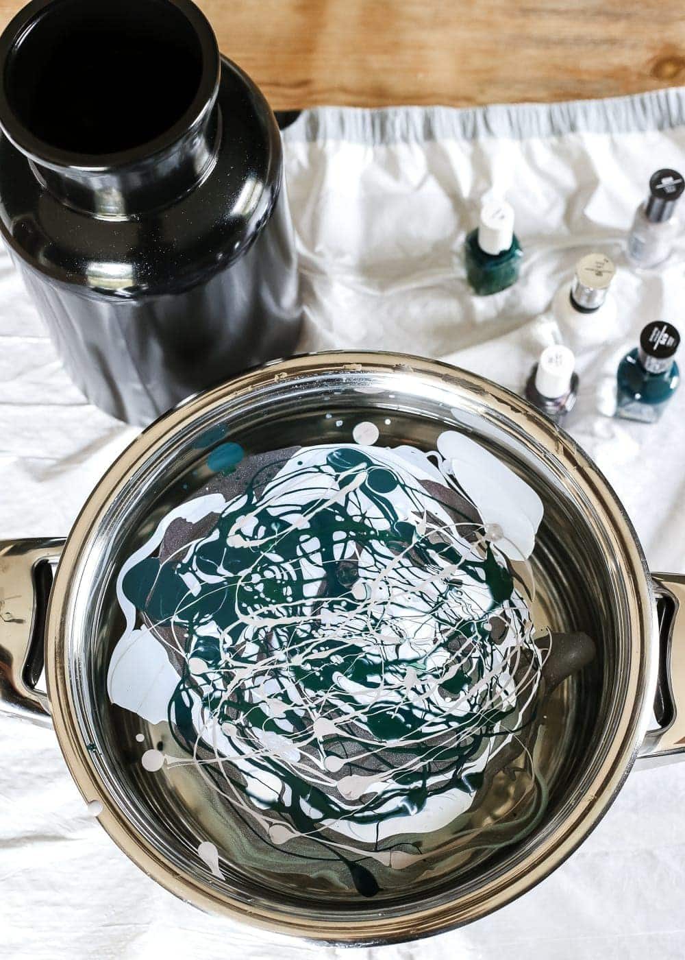 DIY Marbled Vases and Halloween Entryway | unigumushane.com - A quick tutorial for how to turn old jars and bottles into marbled vases (using nail polish) on the cheap that are modern works of art.