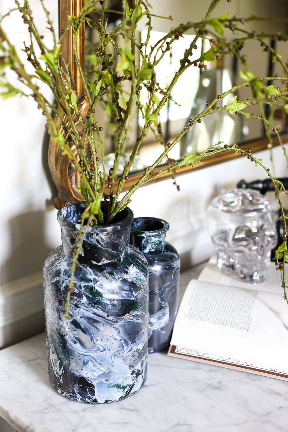 DIY Marbled Vases and Halloween Entryway | unigumushane.com - A quick tutorial for how to turn old jars and bottles into marbled vases (using nail polish) on the cheap that are modern works of art.